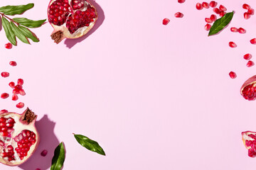 Top view cosmetic background for product presentation with pomegranate extract. Empty Cosmetic circle and square podiums and pomegranate extract on light pink background. Flat lay