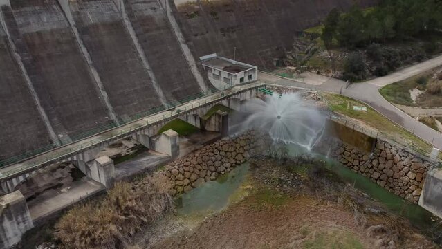 Drone video of the dam relief at its base operating at full capacity with high pressure