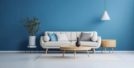Fotobehang Le canapé d'une maison dans un salon. En arrière-plan, un mur bleu.  © Gautierbzh