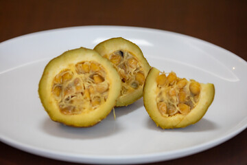 Ripe genipap (Genipa americana) fruit in selective focus and fine details