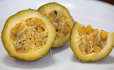 Ripe genipap (Genipa americana) fruit in selective focus and fine details