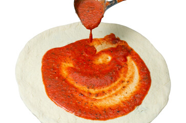 pizza dough with tomato paste applied with kitchen ladle, isolated on white background