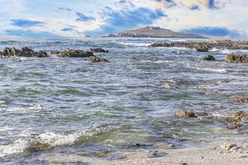 View of the turbulent Atlantic Ocean at Praia Aivados in Portugal in the morning light