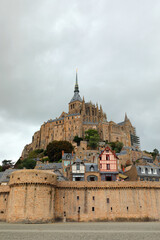 Fototapeta na wymiar Mont Saint Michel abbeyat low tide and medieval city wall