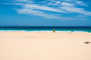 View of the beaches and dunes of Corralejo and a lifeguard hut. Photography taken in Spain, Canary Islands, Fuerteventura.