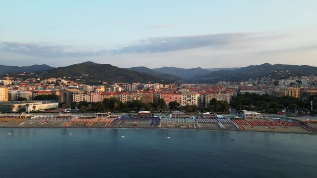 Italian city on the sea coast at sunset, view from a drone.