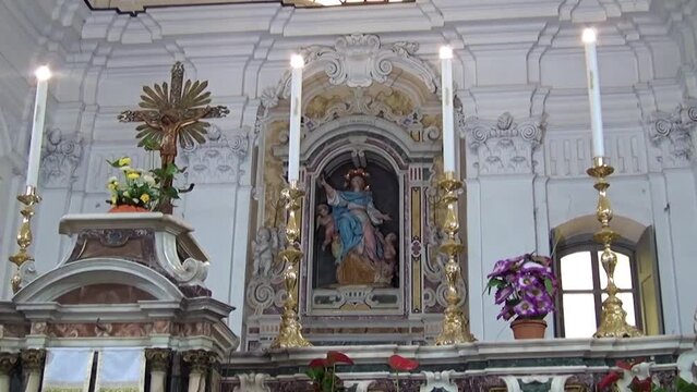 Marble aedicule with Madonna statue and altar in the Church of Saint Maria degli Angeli, Visciano, Naples, Italy