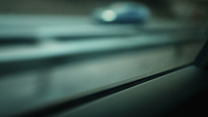 Backseat of car passenger POV staring at window driving through highway road, dreamlike scene