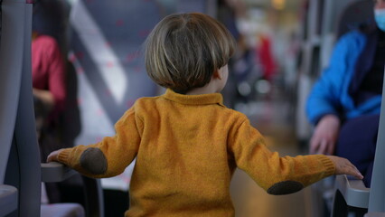 Child pointing finger inside train transportation, little boy childhood education concept of not...