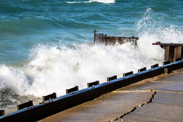 waves crashing on the pier