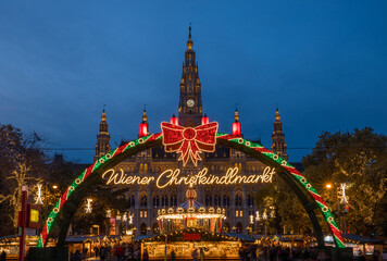 Decorations (translation: Viennese Christmas market ) of Christmas market in Rathaus park with City...
