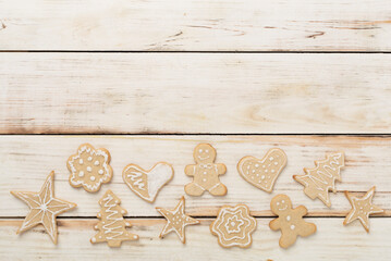 Cute homemade Christmas cookies on wooden background,top view