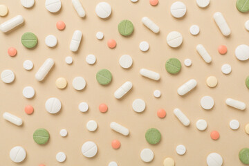 Flat lay with different medical pills and capsules on color background