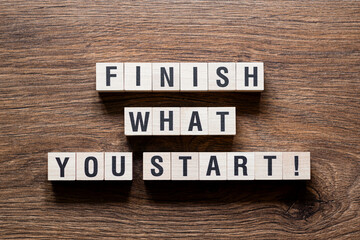 Finish what you start - word concept on building blocks, text