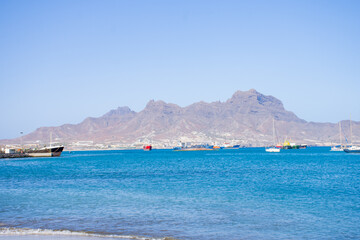 Landscape View of Laginha beach and small boat in Mindelo city in Sao Vicente Island in Cape Verde