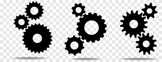 Three sets of black cogs (gears) with shadow