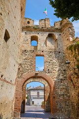 Beautiful view of the city gate in the historic centre of Castellaro Lagusello, Monzambano, Lombardy, Italy.