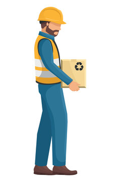 Industrial worker with his personal protective equipment, helmet, vest, safety shoes carrying a box. Safety First. Industrial safety and occupational health at work