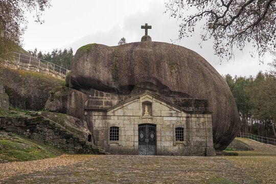 Religious Architecture. Church Our Lady of Lapa was built under a rock, known as Santu&aacute;rio de Nossa Senhora da Lapa. Mountainous area with hiking trails, next to Soutelo, P&oacute;voa de Lanhoso, Portugal.