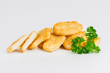 Chicken Breaded Fillet.Fast food. Breaded Chicken Inner Fillet on a White Background,Chicken Breaded Raw Meat. Fast cooking. Breaded chicken nuggets. Homemade food at home.