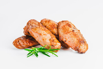 Chicken wings fried until half cooked, semi-finished product with fresh herbs on a white background. Fast food. Fast cooking.Quick cooking at home. Copy space.Fast homemade food.Raw chicken meat.
