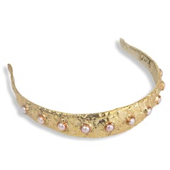 Unique gold and pearl headband on white background