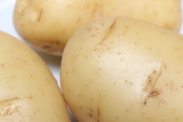 close up of potatoes. potatoes with selective focus. unpeeled potatoes. food details. natural food...
