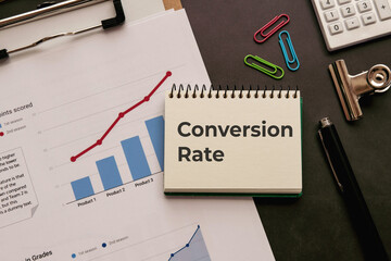 There is notebook with the word Conversion Rate. It is as an eye-catching image.