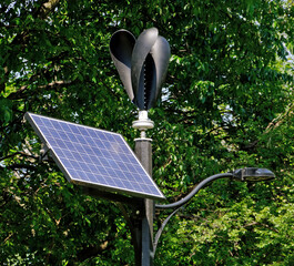 Wind turbine and solar panel hybrid street light system