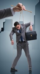 Businessman puppet being manipulated by boss