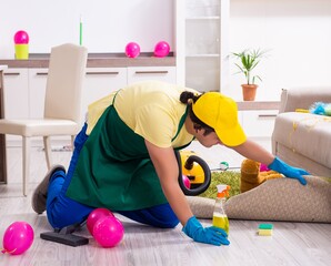 Young male contractor doing housework after party