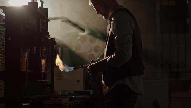A Jeweler Crafts a Gold Ring Using a Gas Torch in an Old Workshop