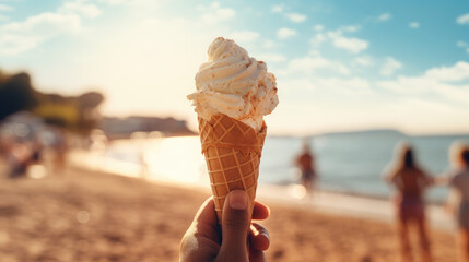 This image features an individual enjoying a vanilla gelato on a sunny beach, with family and friends in the background, embodying the essence of a wonderful summer day.