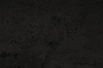 Texture of black stone surface as background, closeup
