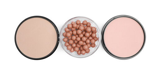 Different face powders isolated on white, top view