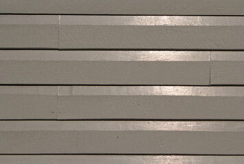 Painted wooden siding cladding on the wall of a building
