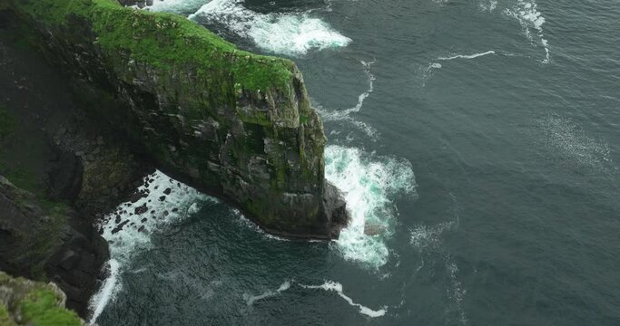 Fly over picturesque cliffs, high cliffs leaning over the ocean