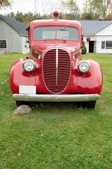 Front view of vintage 1935 bright red fire truck. This restored fire truck was once used by the...