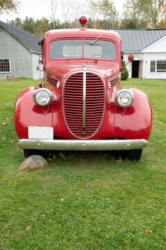 Front view of vintage 1935 bright red fire truck. This restored fire truck was once used by the fire department in Sugar Hill, New Hampshire.