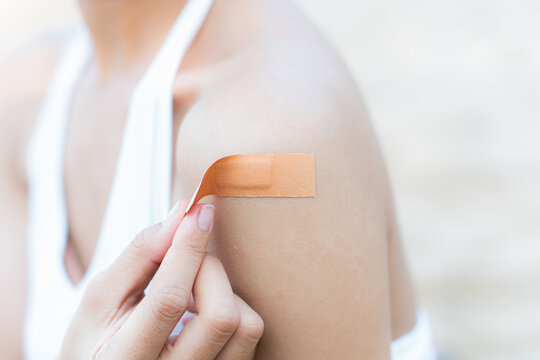woman arm with an adhesive bandage
