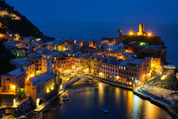 View of Vernazza village popular tourist destination in Cinque Terre National Park a UNESCO World Heritage Site, Liguria, Italy view illuminated in the night from Azure trail - 679923322