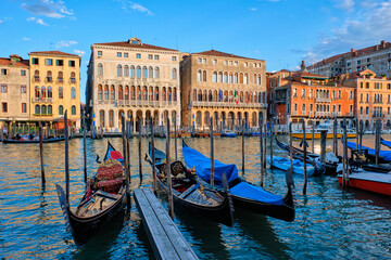 Fototapeta na wymiar Grand Canal with boats and gondolas on sunset, Venice, Italy