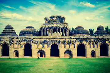 Vintage retro hipster style travel image of ancient ruins of Elephant Stables, Royal Centre. Hampi,...