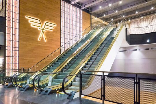 October 28, 2023 - Chicago, Illinois, USA: Interior of the Old Post Office, Van Buren St. showing brightly lit first floor, large logo, and escalators. 