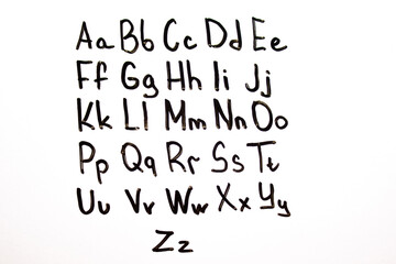 English alphabet, letters written with a marker on a blackboard. English alphabet, learning English, knowledge, education.