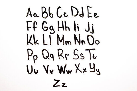 English alphabet, letters written with a marker on a blackboard. English alphabet, learning English, knowledge, education.