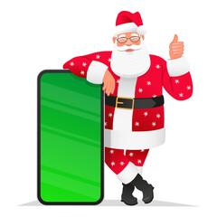 Cute and cheerful Santa Claus in a beautiful suit with snowflakes is standing at a huge smartphone with a chroma key. Old Santa points to the mobile phone screen.