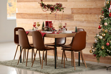 Festive dining table with Christmas setting and beads in room