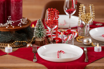 Christmas table setting with beads in room, closeup