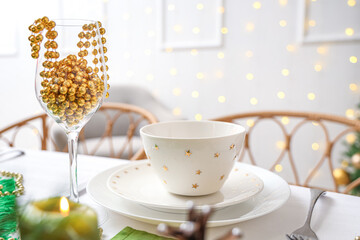 Christmas table setting with beads in room, closeup